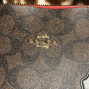 Dark brown and red coach bag